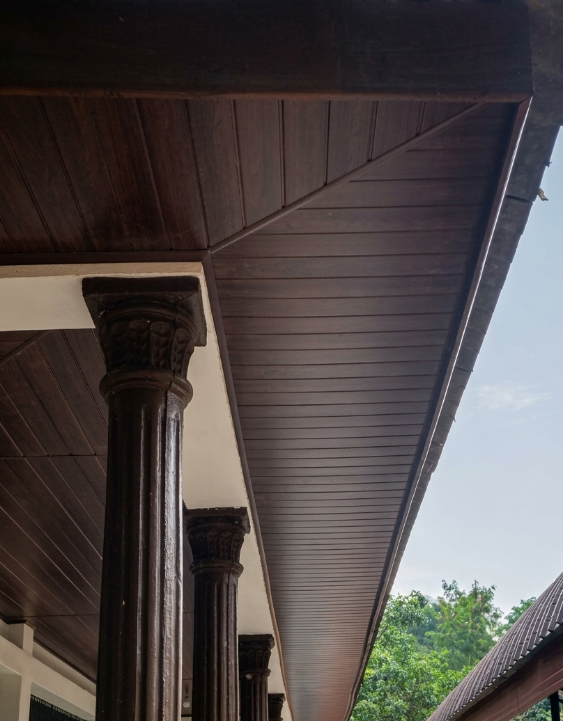 Dark wood I-Panel roofing with ornate columns