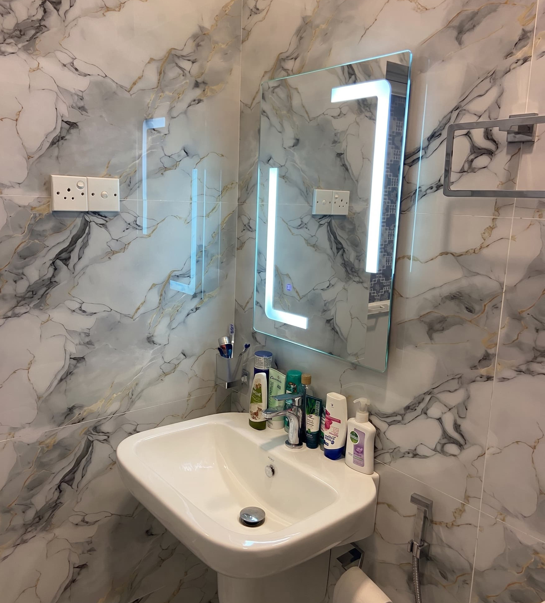 Bathroom renovation with tiled walls and vanity