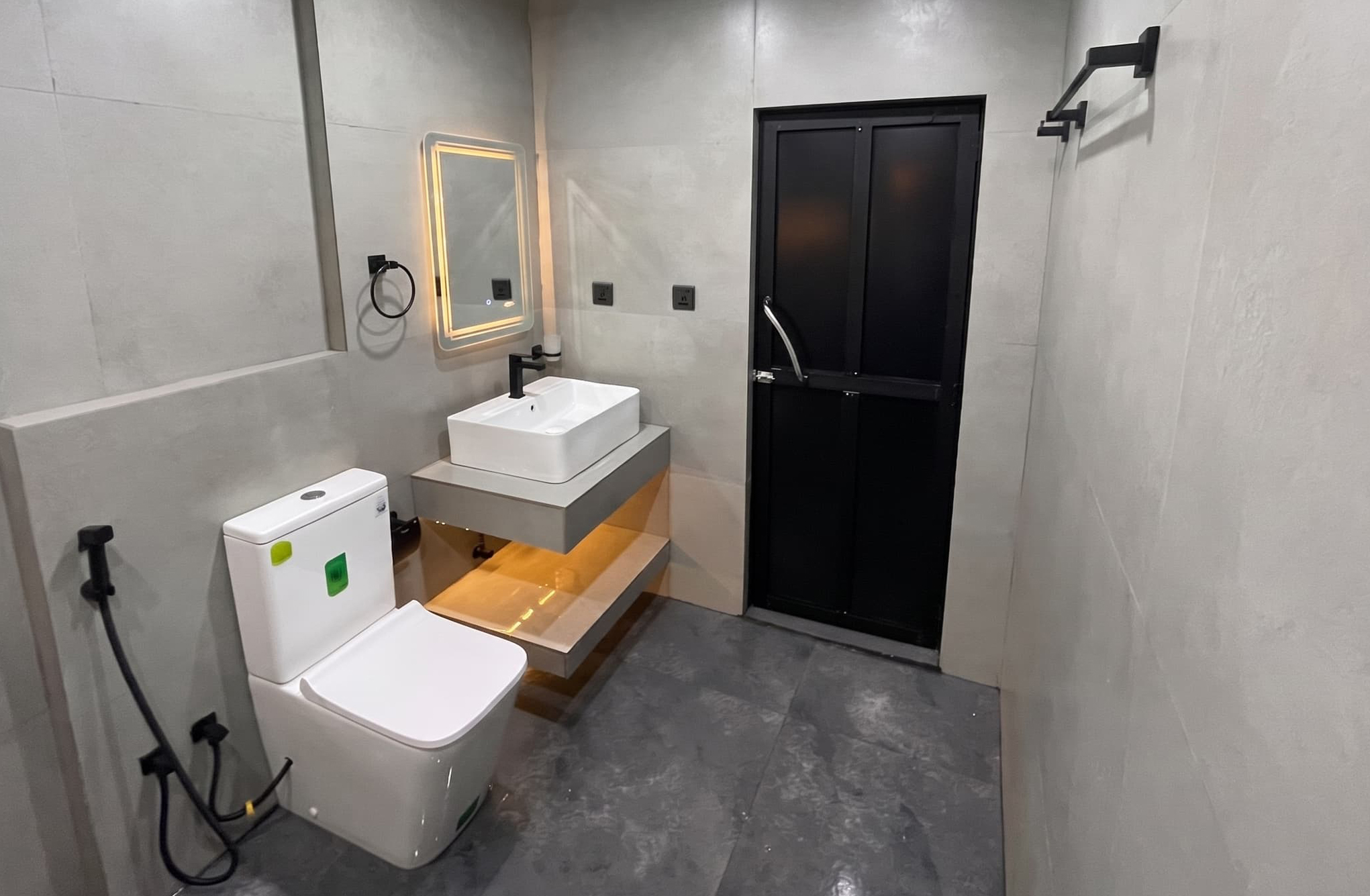 Bathroom renovation with shower area and lighting